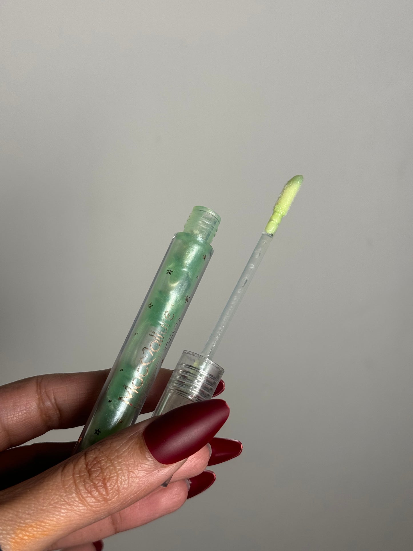 GREEN CLEAR LIPGLOSS WITH GLITTER PARTICLES