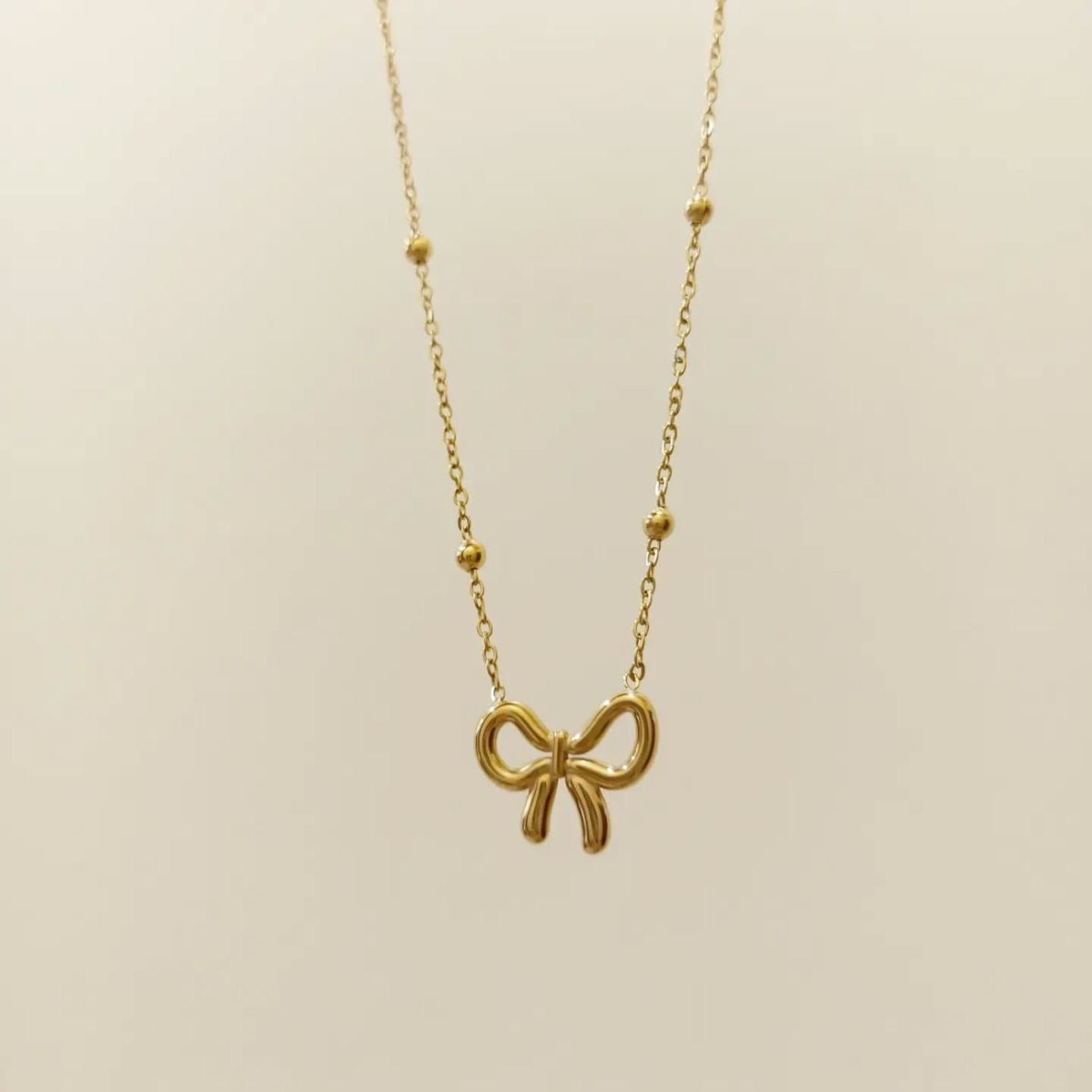 B117 BOW NECKLACE