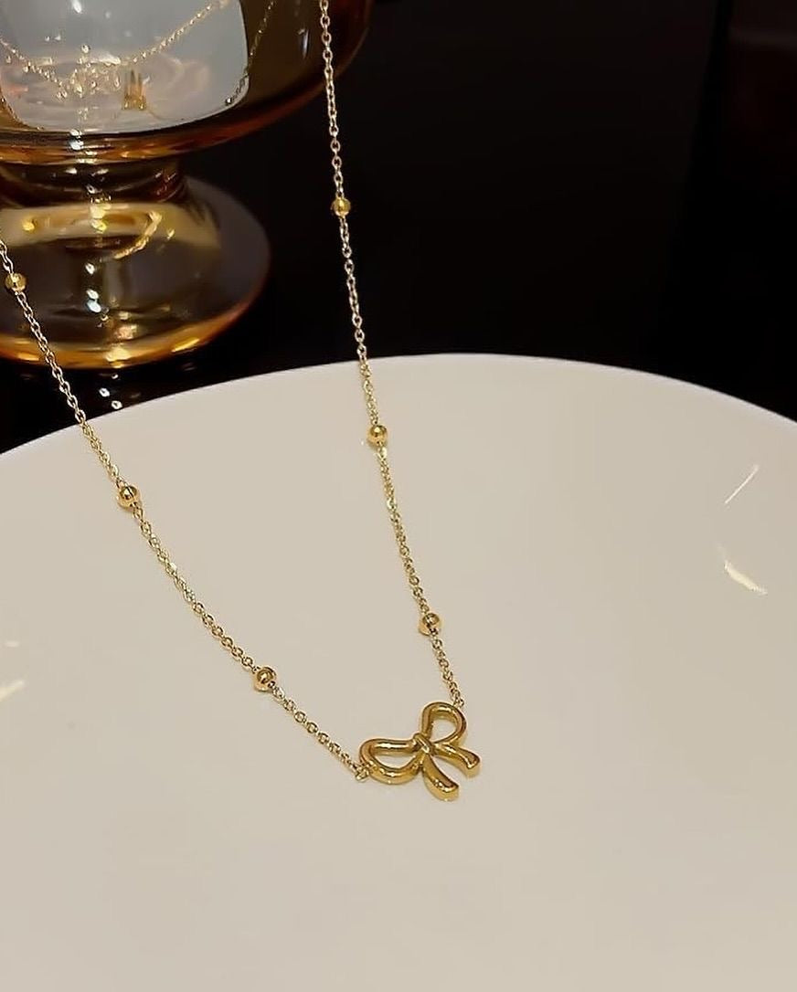 B117 BOW NECKLACE