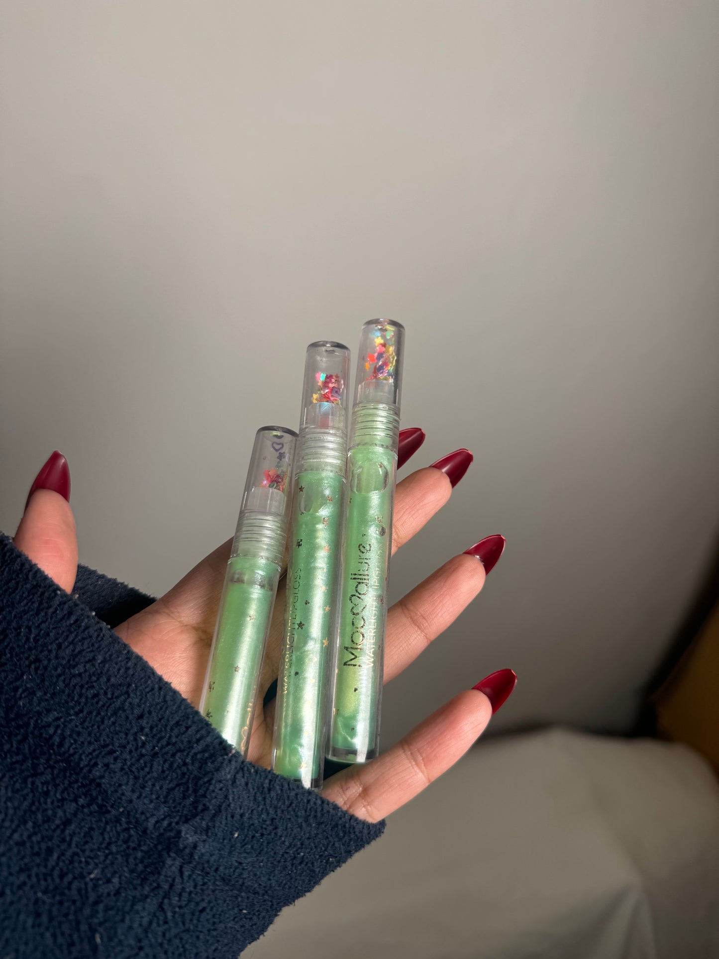 GREEN CLEAR LIPGLOSS WITH GLITTER PARTICLES