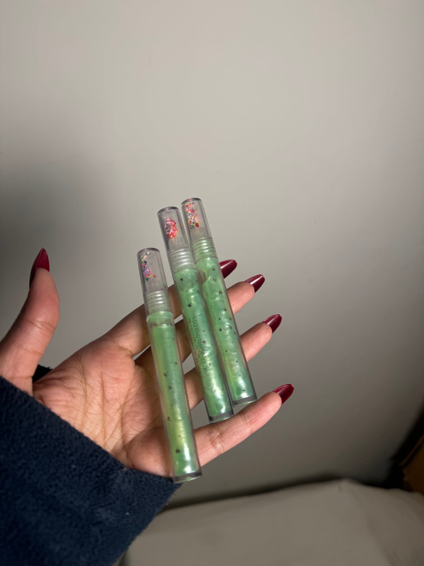 GREEN CLEAR LIPGLOSS WITH GLITTER PARTICLES