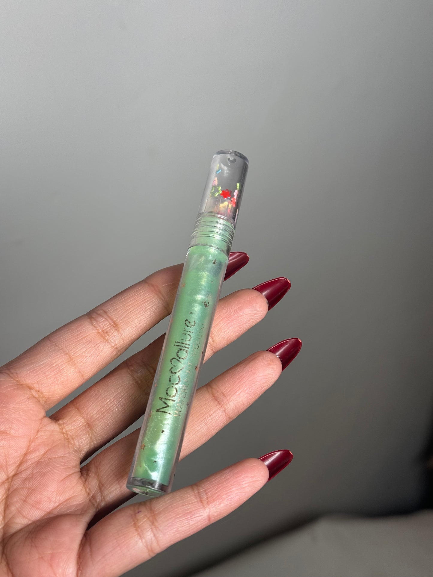 GREEN CLEAR LIPGLOSS WITH GLITTER PARTICLES