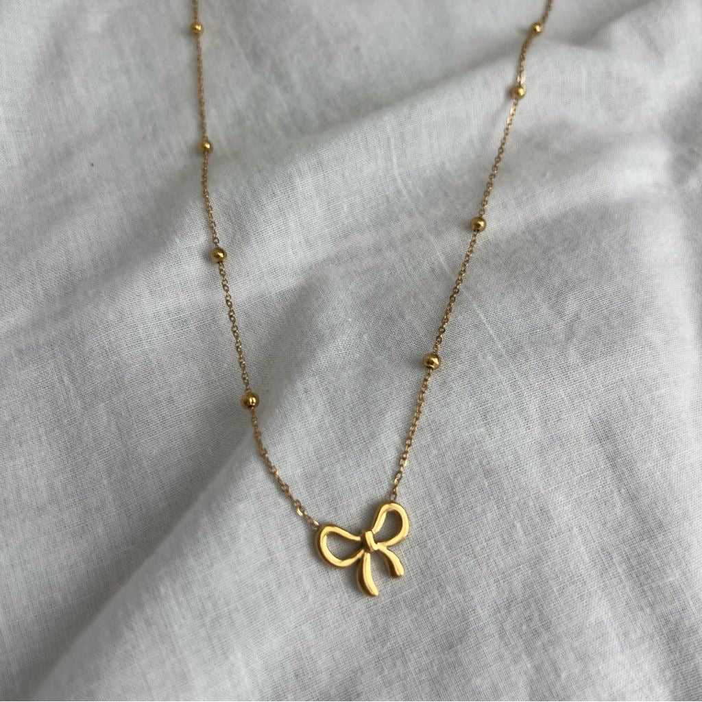 B117 BOW NECKLACE